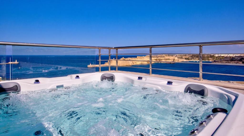a jacuzzi tub on a cruise ship at Valletta Luxury 4-Bedroom Duplex with Stunning Sea Views Private Terrace and Jacuzzi in Valletta