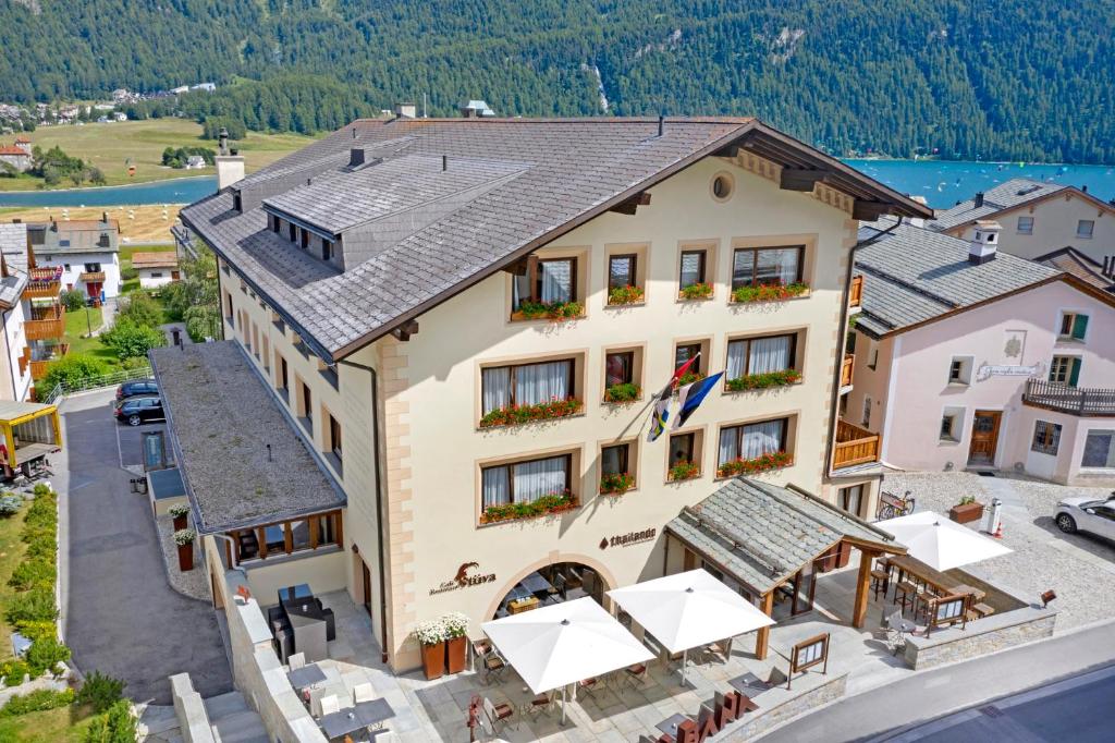 an aerial view of a hotel with a restaurant at Albana Hotel Silvaplana in Silvaplana
