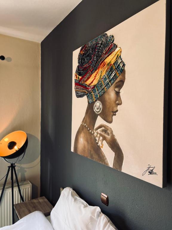 a painting of a woman in a headdress on a wall at Elia in Ptolemaida