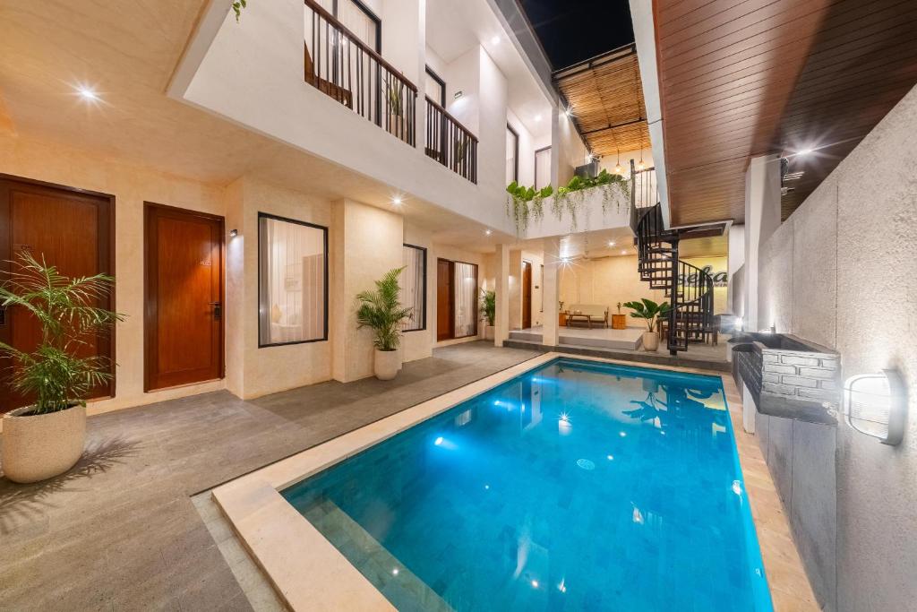 an indoor swimming pool in a house with plants at Sekala CoLiving Canggu - Minutes away to Finns and Atlas Beach Clubs in Canggu