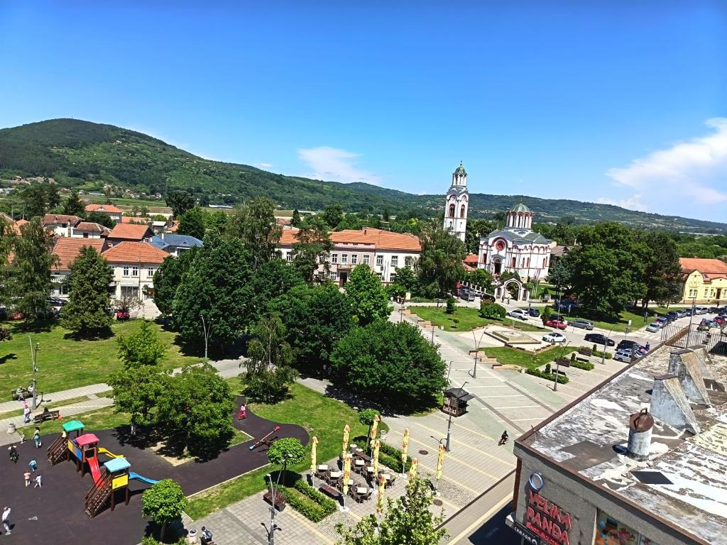 a view of a city with a park and buildings at Apartman Kneginja in Trstenik