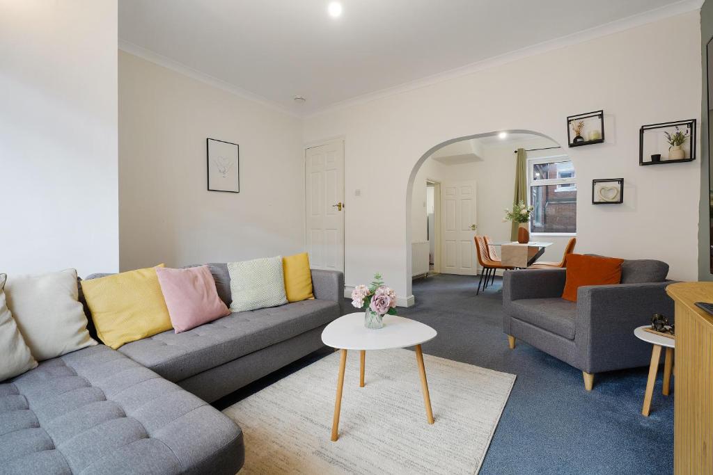 a living room with a couch and a table at Your Second Home - Work Stay - Free Parking in Bishop Auckland