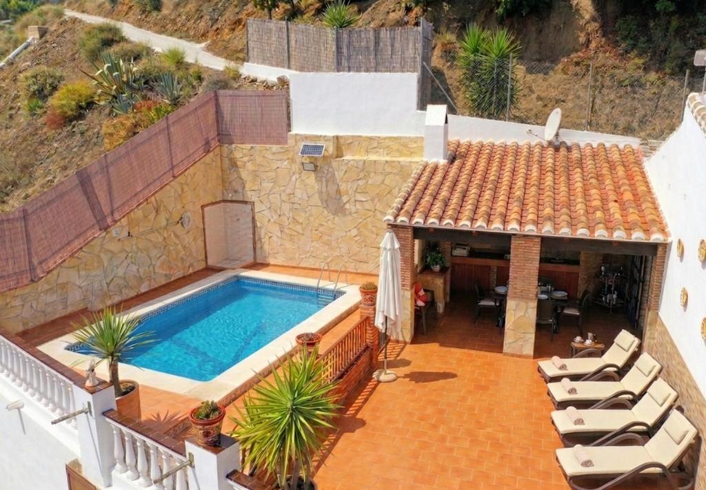 an image of a house with a swimming pool at Villa Alabarce Nerja by Spain Sun Rentals in Nerja
