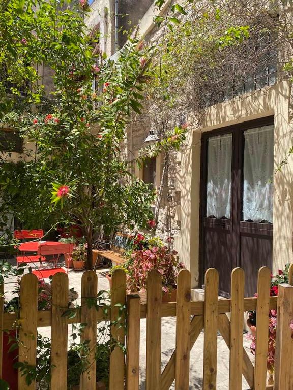 a wooden fence in front of a house at Case del Vicolo Stretto in Modica