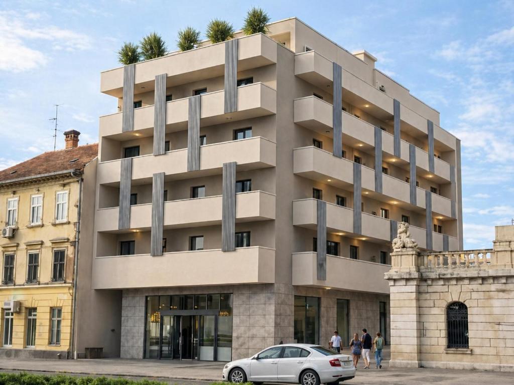 a building with a car parked in front of it at Sunday Residence Split in Split