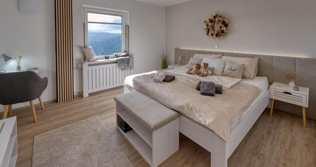 a bedroom with a bed with a teddy bear on it at Apartments Saint Thomas in Selca