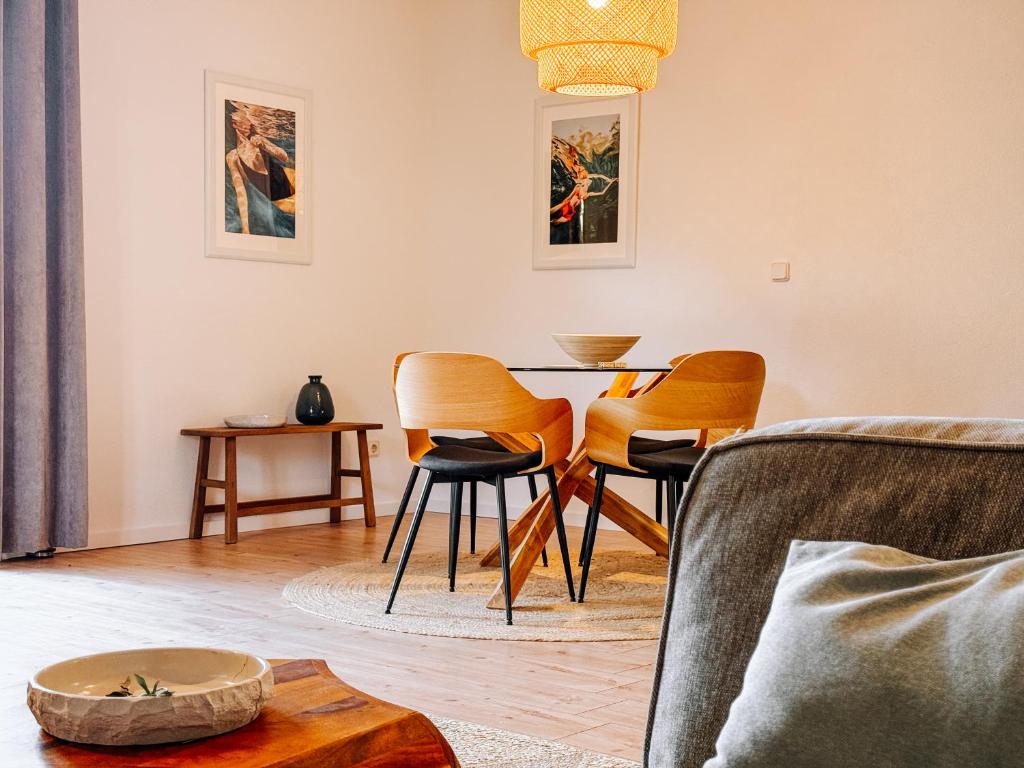 a living room with a table and chairs at House Jelka - Apartment Nina in Supetar