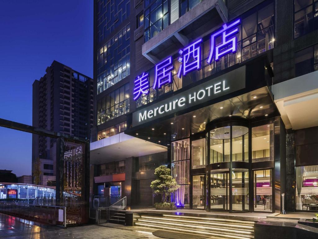 a building with a sign for a medicine hospital at Mercure Chengdu Downtown Hotel in Chengdu