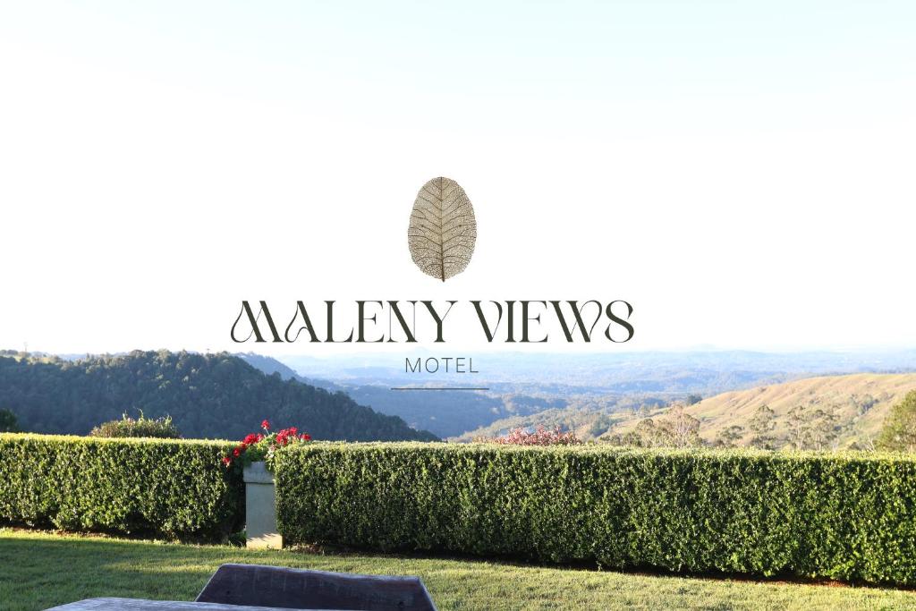 a sign that reads valley views motel with a hedge at Maleny Views Motel in Maleny