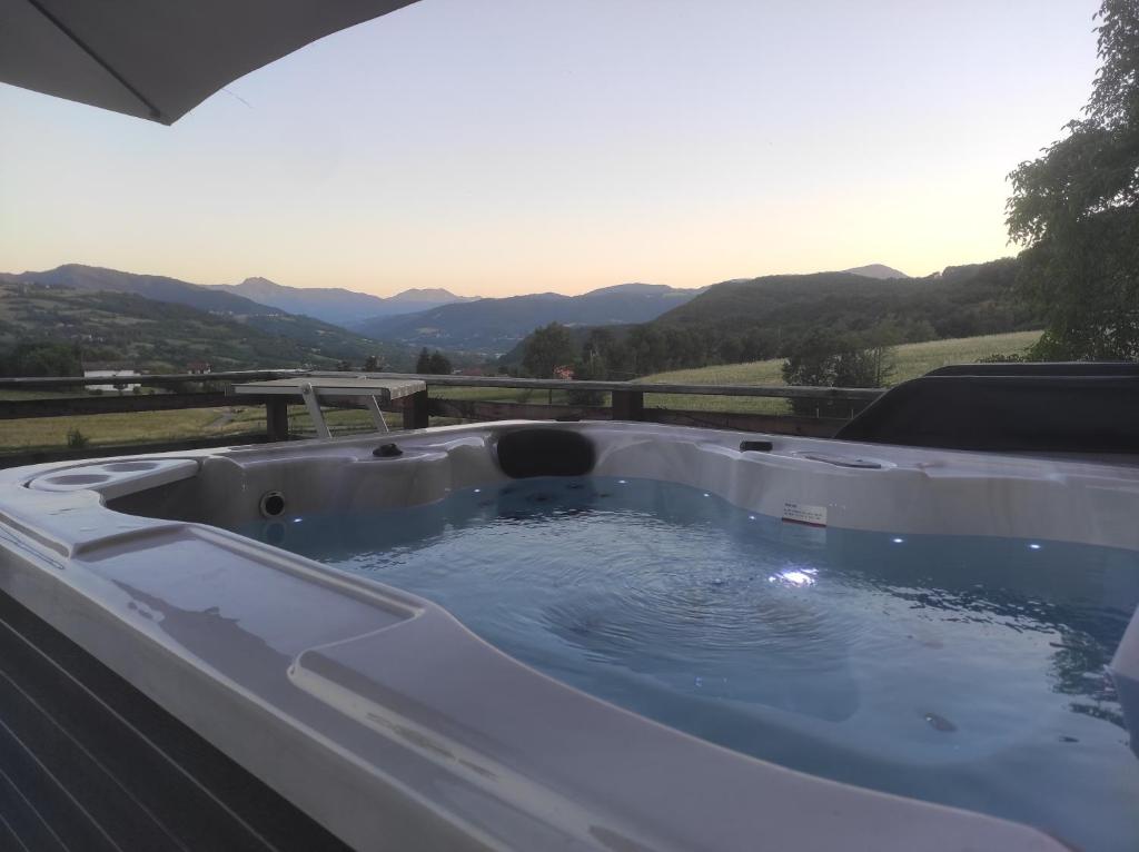 a bath tub filled with water on top of a house at B&B Max & Lory in Neviano degli Arduini