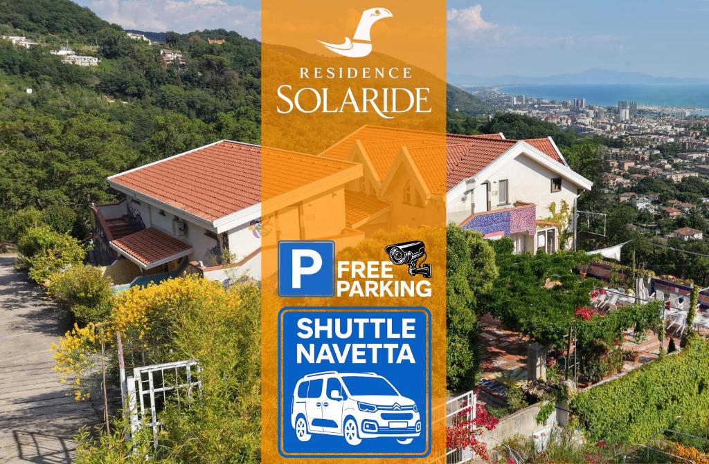 a pole with a parking sign in front of a house at RESIDENCE SOLARIDE apartments, FREE PRIVATE PARKING WITH VIDEOSURVELLIANCE and SHUTTLE SERVICE in Salerno