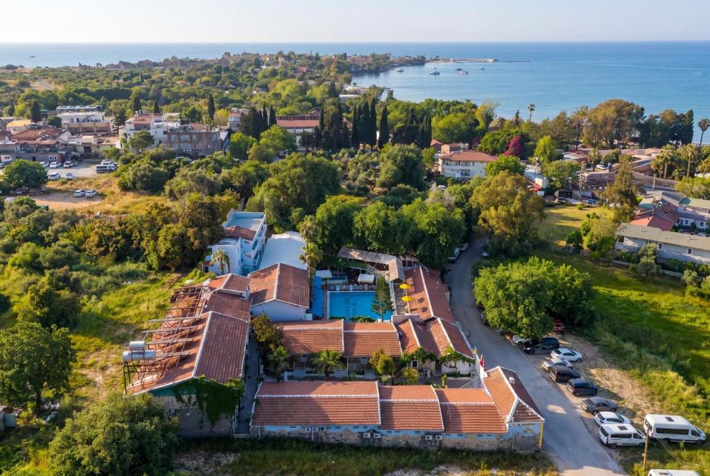 an aerial view of a town with houses and the water at Side Temple Hotel in Side