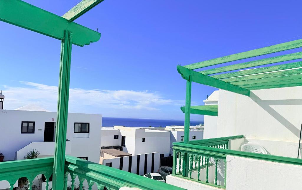 a view of the ocean from the balcony of a house at -MONTORIAN View LANZAROTE- in Puerto del Carmen
