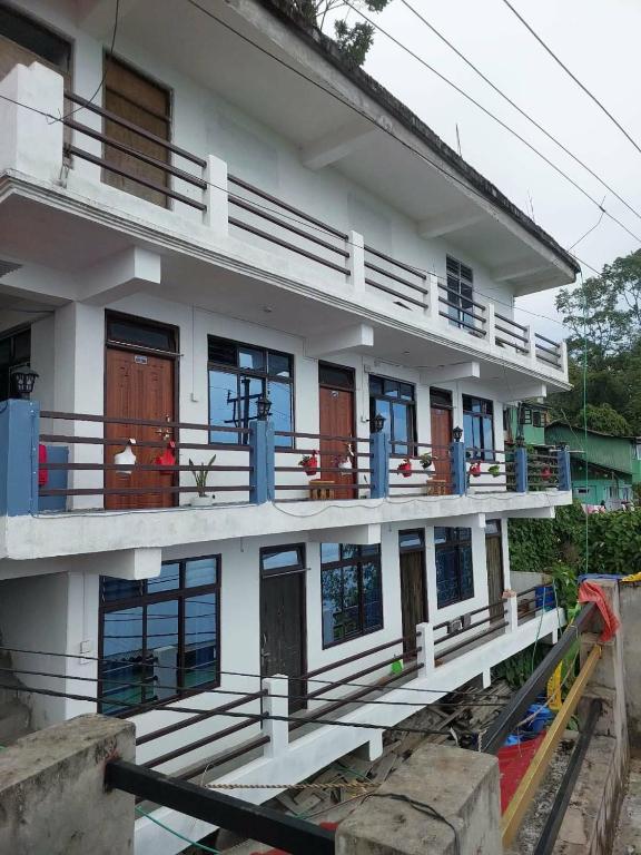 a building under construction with a lot of windows at grace homestay in Darjeeling