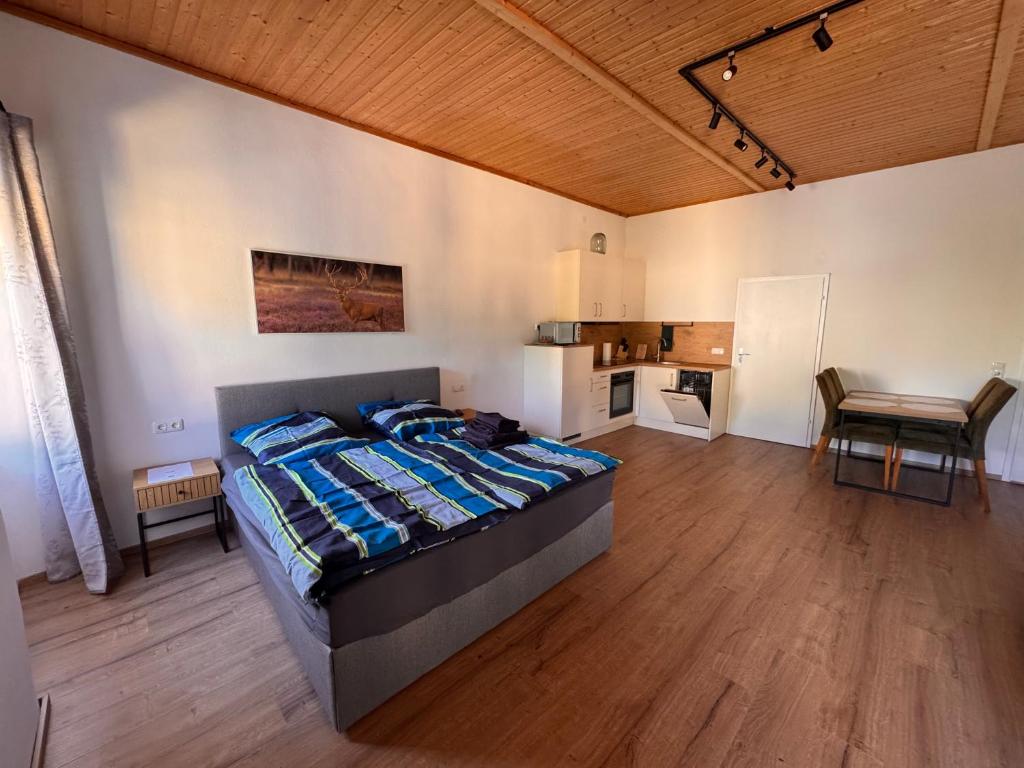 a bedroom with a bed and a table in it at Kaiser von Österreich in Bad Aussee