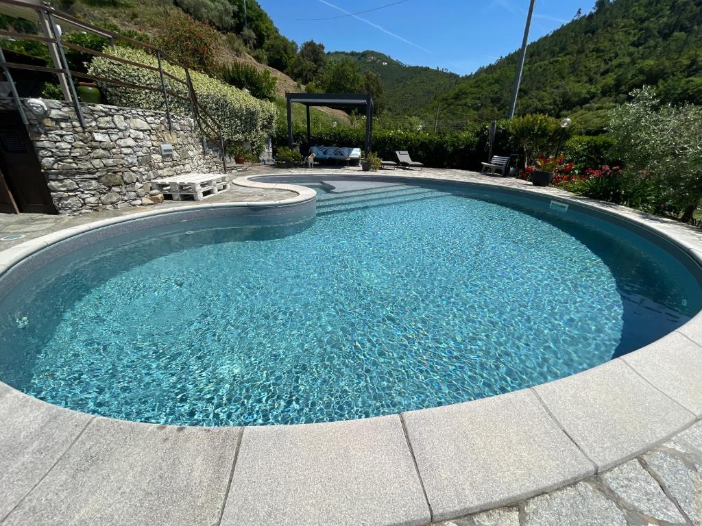 a large swimming pool with blue water at Eucalipto in Sestri Levante