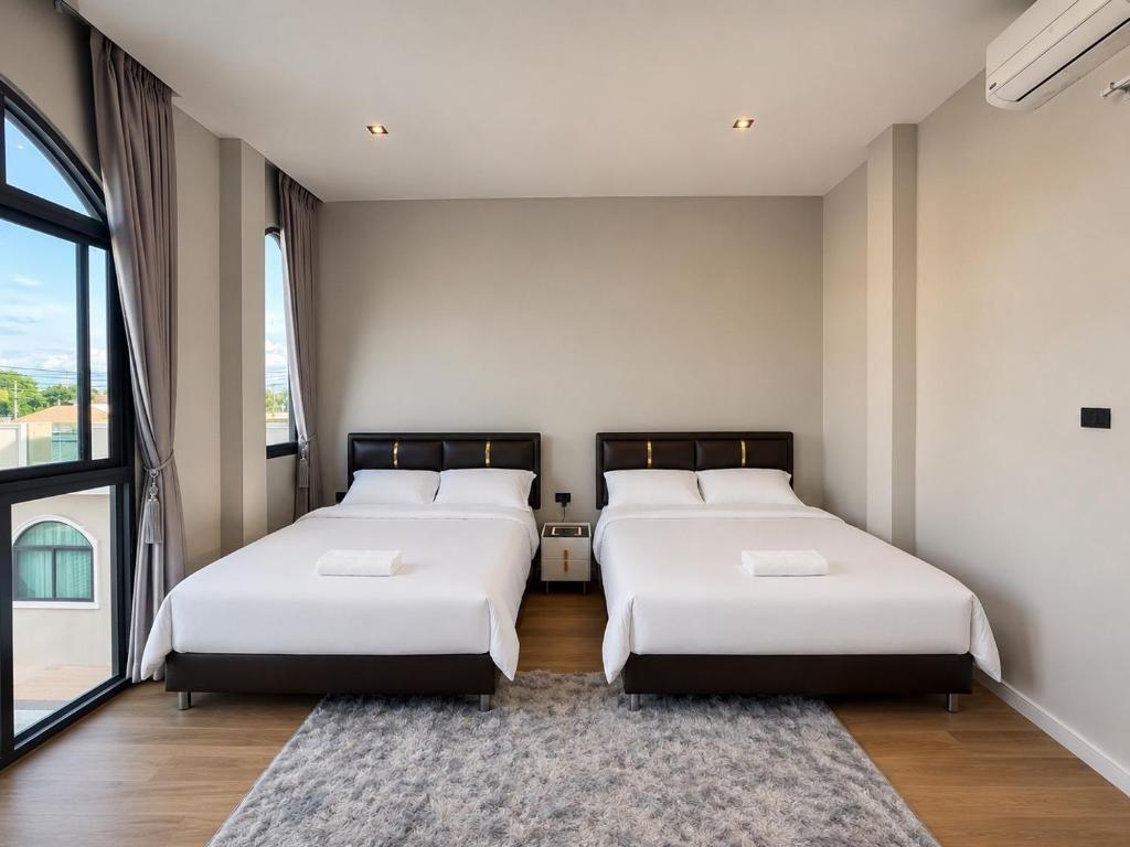 two beds in a room with a large window at An An Pool Villa in Nong Prue