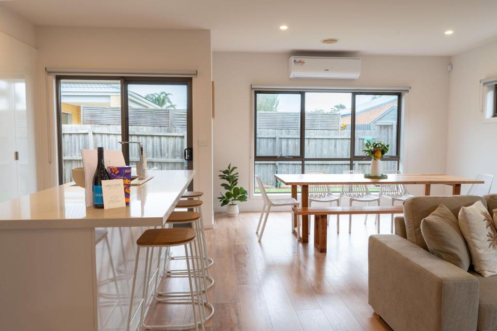 a living room with a couch and a table at Shell Escape at Ocean Grove in Ocean Grove
