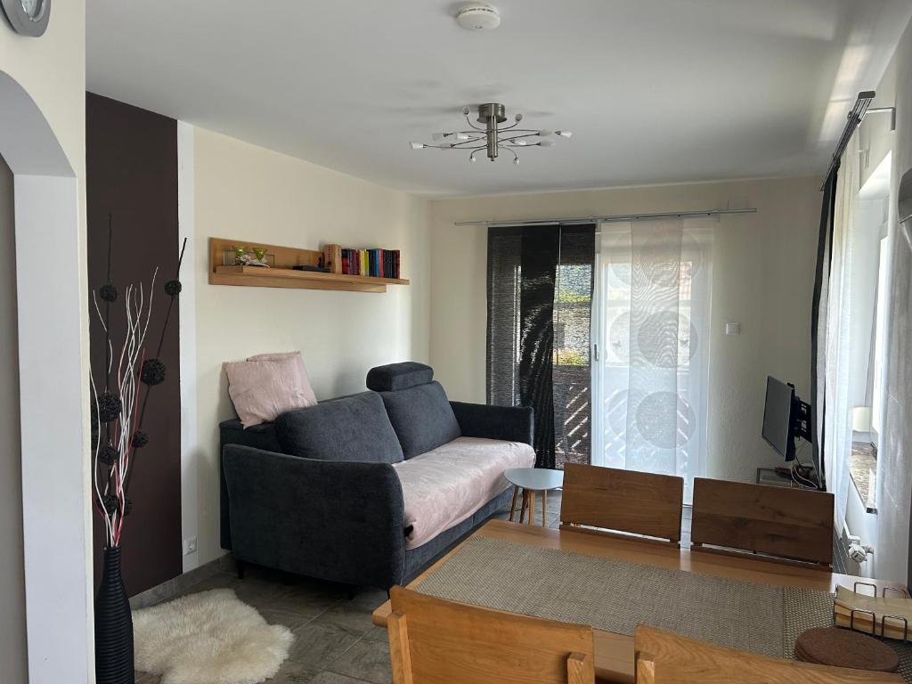 a living room with a couch and a table at Appartement Stichauner in Tschöran