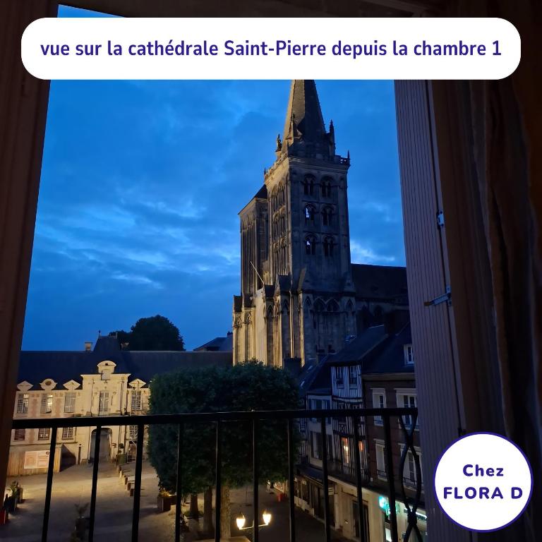 a view from a balcony of a building at Chez FLORA D - Lisieux hypercentre - in Lisieux
