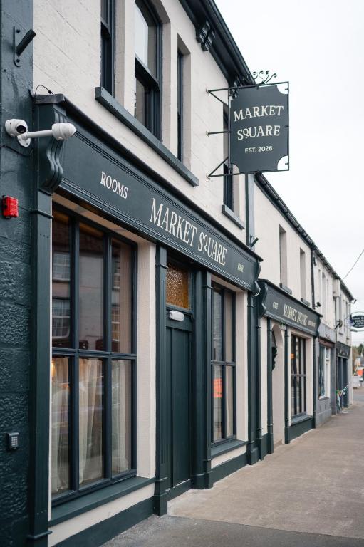 a row of store fronts on a street at Market Square in Monasterevin