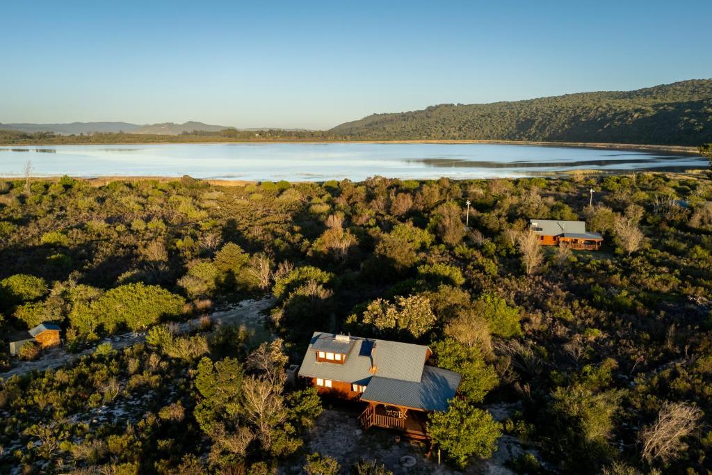 an aerial view of a house and a lake at Reflections Eco-Reserve in Wilderness