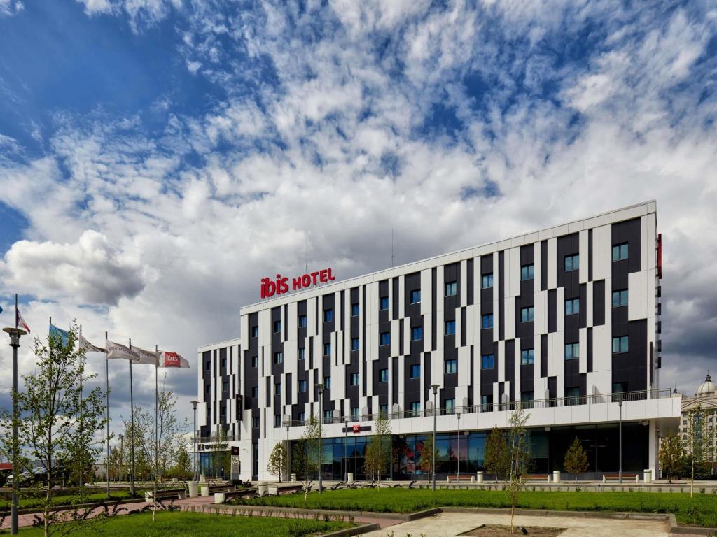 a building with a us unite sign on it at Ibis Aktobe in Aktobe