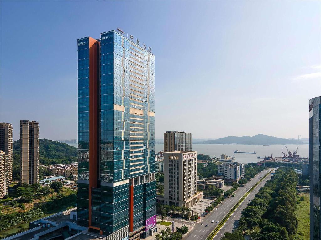 a view of a tall building in a city at Mercure Guangzhou Nansha in Guangzhou