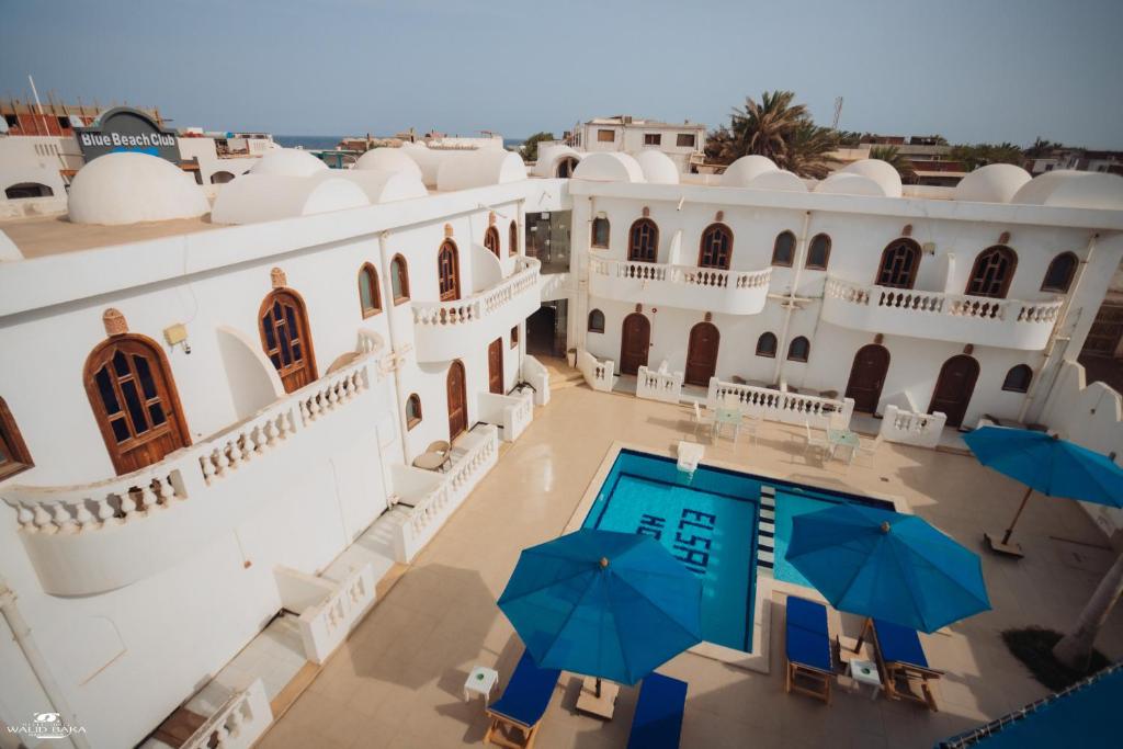 an aerial view of a villa with a pool and umbrellas at El Salam hotel in Dahab
