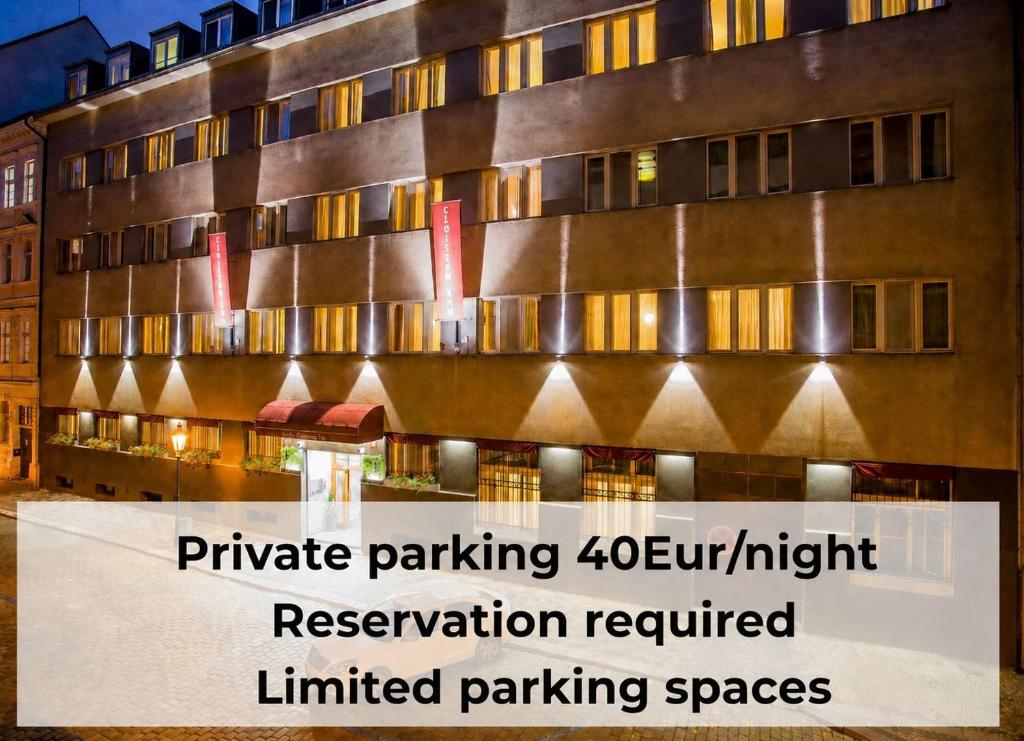 a building with a sign in front of it at Cloister Inn Hotel in Prague