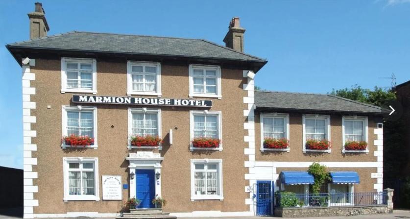 a mancham house hotel on the side of a street at Marmion House Hotel in Wisbech