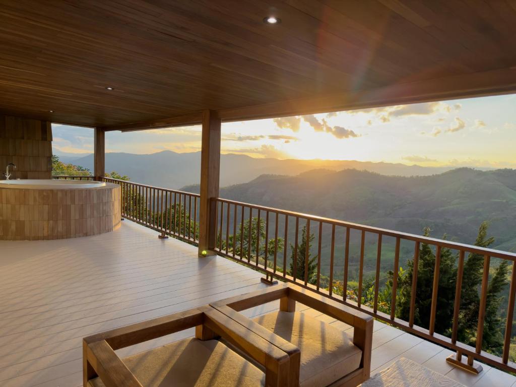 a balcony with a view of the mountains at Tramont in Ban Huai Khai