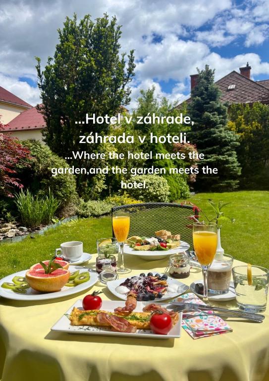 a table with food and drinks on it at Hotel Garni Expo in Banská Bystrica