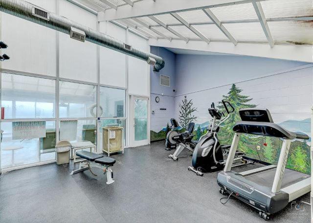 a gym with bikes and a room with motorcycles at WP252 Be Our Guest in Pigeon Forge