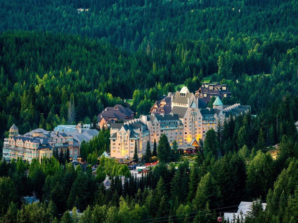 a resort town on a mountain with trees at Fairmont Chateau Whistler in Whistler