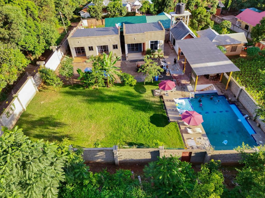 an aerial view of a house with a swimming pool at Kilistone Apartments in Uru