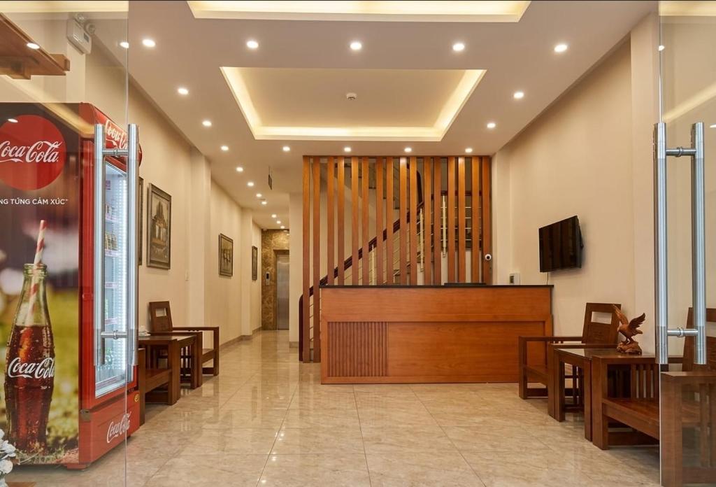 a lobby with a large organ in a building at An Phú Nguyễn Hoàng Hotel in Hanoi