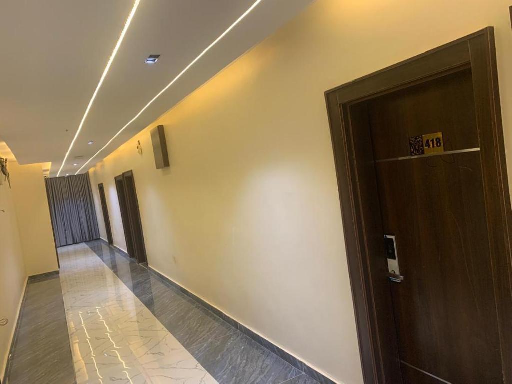 a hallway with a door in a building at Adwels Hotel&Suites in Akure