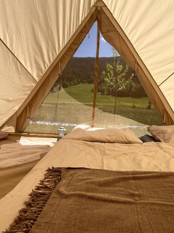 a view from inside of a tent with a view at Wiesn-Relax-Camping in Ranten