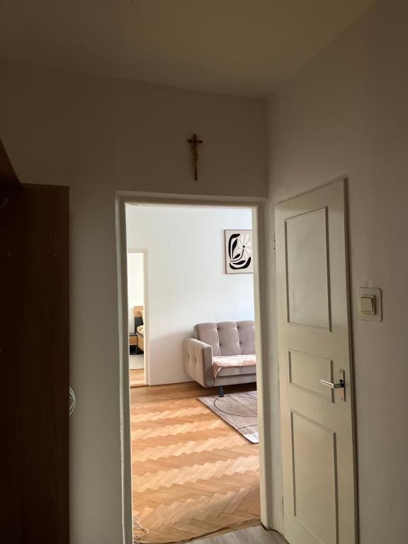 a door leading into a living room with a couch at Exnárova in Prievoz