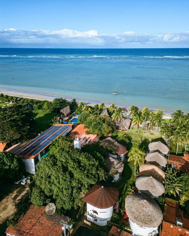 an aerial view of a resort and the ocean at Pousada Barra Velha in Maragogi