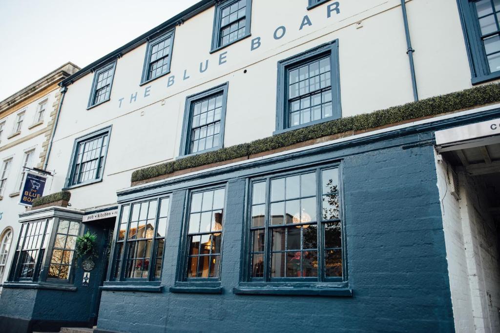 a large building with windows and windows on the side of it at The Blue Boar in Witney