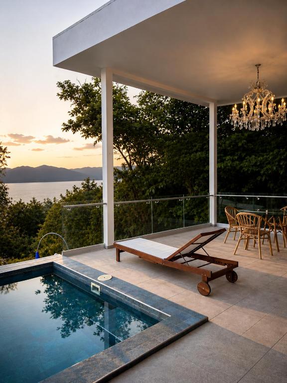 a house with a swimming pool and a chandelier at Hotel y Restaurante Buganvilias in Las Aradas