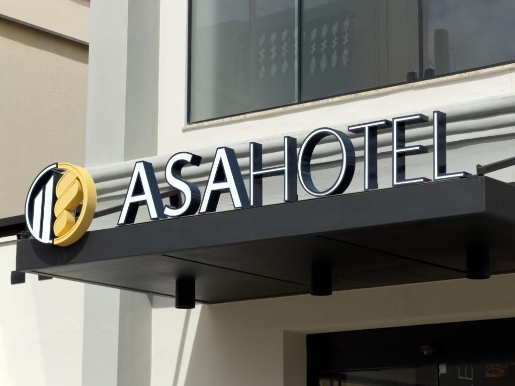 aania sign on the side of a building at Asa Hotel in Piracicaba