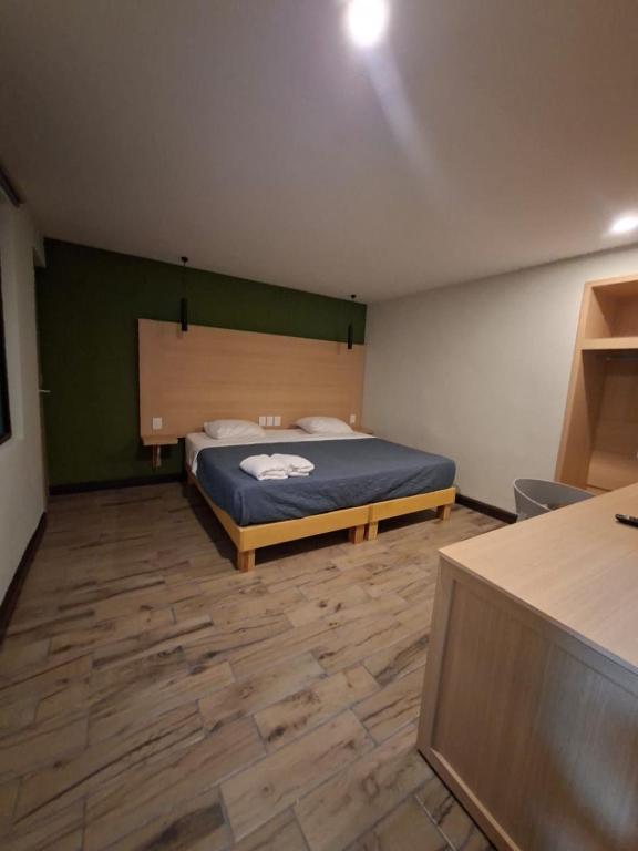 a bedroom with a bed in the middle of it at Hotel casa el Palomar - 3 in San Baltasar