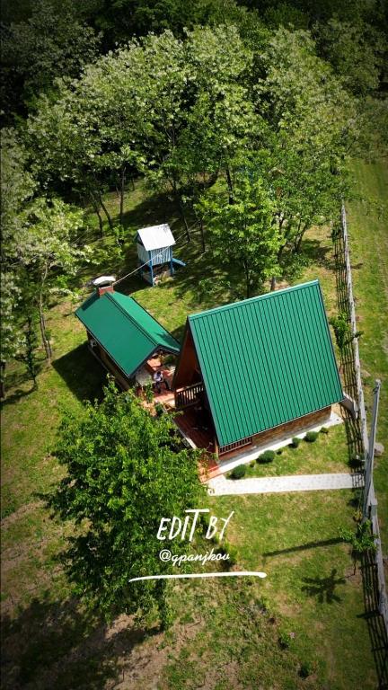 an overhead view of a house with a green roof at Medeni brijeg in Donji Potok