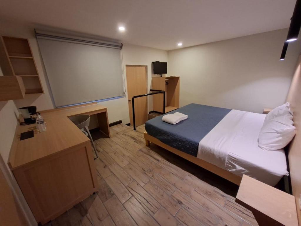 a room with a bed and a projection screen at Hotel casa el Palomar -5 in San Baltasar