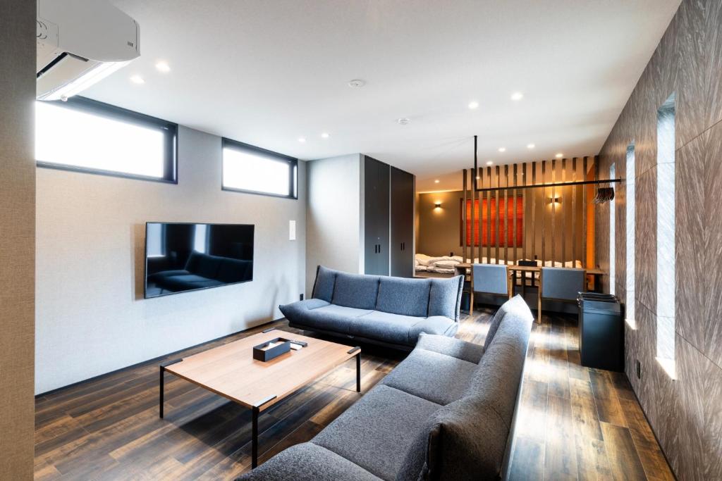 a living room with a couch and a table at 2F, 3F - Vacation STAY 20122v in Sumiyoshi