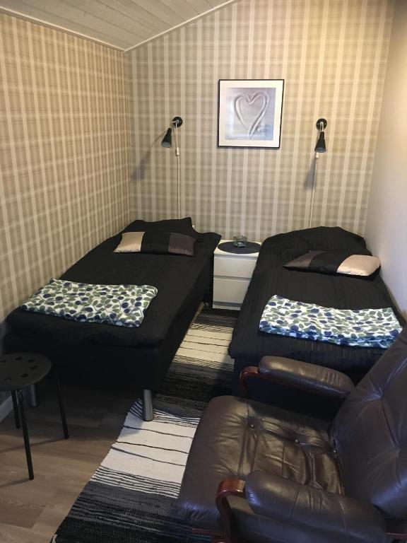 Postel nebo postele na pokoji v ubytování Gripenbergs Gårdsbutik