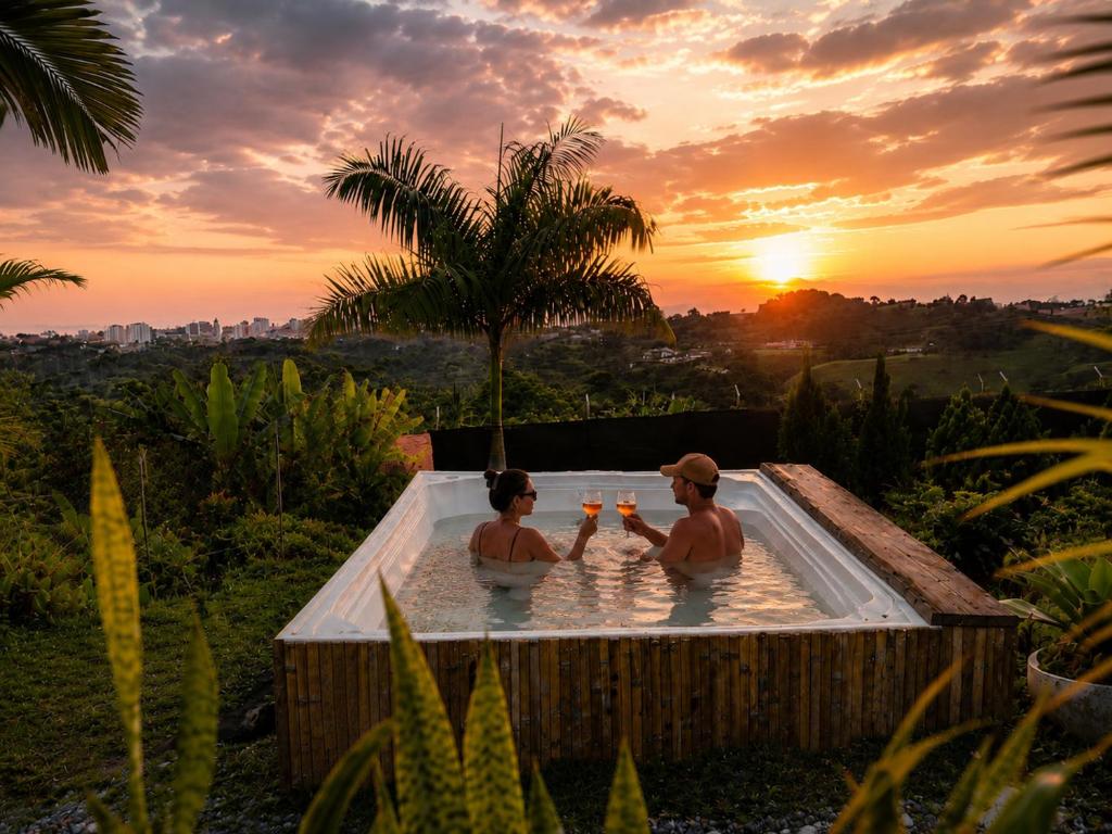 two women sitting in a hot tub at sunset at Casa Atelier AXM in Salento